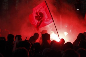 Far-right protesters light flares in front of the building of Russian embassy during the annual far-right march, which coincides with Poland's national Independence Day in Warsaw