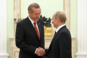 Turkish President Recep Tayyip Erdogan shakes hands with Russian President Vladimir Putin