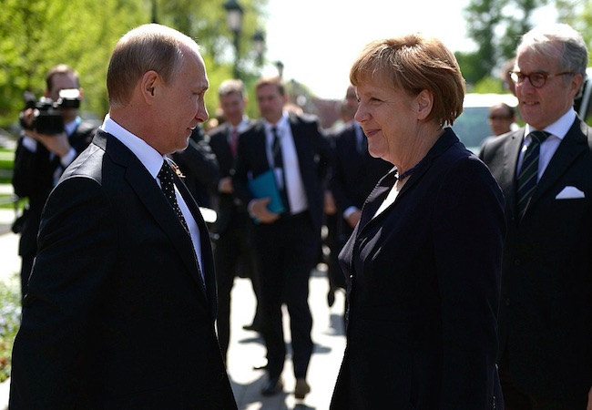 Putin, Merkel call for political dialogue in Ukraine, bilateral ...