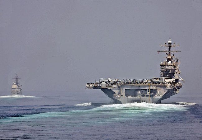 U.S. Navy photo of the USS Abraham Lincoln and USS Cape St. George transitioning through the Strait of Hormuz on May 11, 2012. (Photo: Courtesy of WikiCommons)